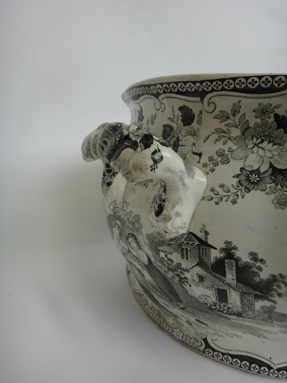 A large twin handled Victorian foot bath, with black printed decoration