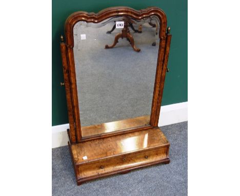 'T. Wilson, 68 Great Queen Street, London'; an 18th century walnut toilet mirror, with shaped bevelled mirror plate over sing
