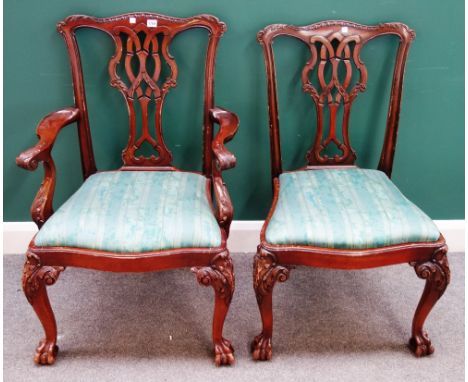 A set of eight Chippendale Revival style mahogany framed dining chairs, with interlaced pierced splat, and claw and ball feet