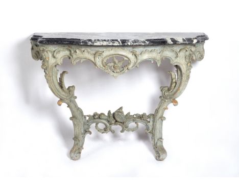 A 19th century console table, the serpentine marble top over a grey painted carved wood base with opposing 'C' scroll support