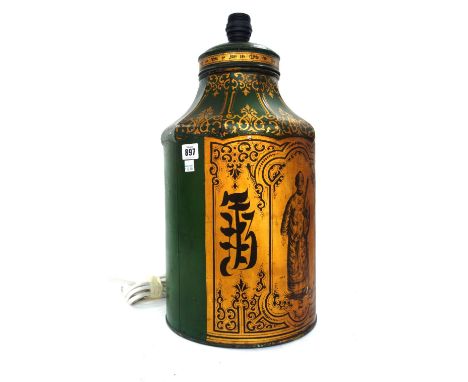 A Victorian japanned tea canister adapted as a table lamp, decorated gilt figure and script against a green ground, canister 