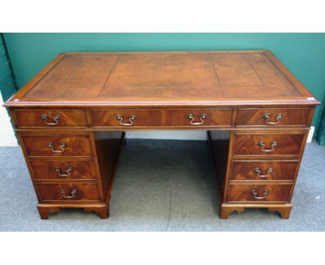 An 18th century style mahogany pedestal desk, with nine drawers about the knee, on bracket feet, 153cm wide x 78cm high x 92c