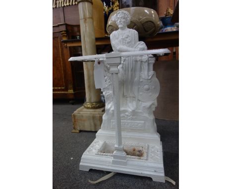 A white painted cast iron stick stand, titled 'WALLACE' with figural backplate and removable drip pan, 77.5cm high.