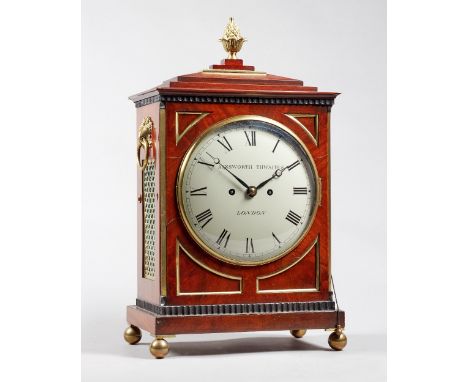 A Regency brass-mounted mahogany bracket clockCirca 1810The chamfer top case surmounted by a pineapple finial, with brass gri