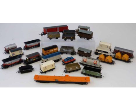 Twenty seven 00 guage rolling stock, guards van, coal truck, Shell, Tarmac, Blue Circle etc. Condition report: see terms and 