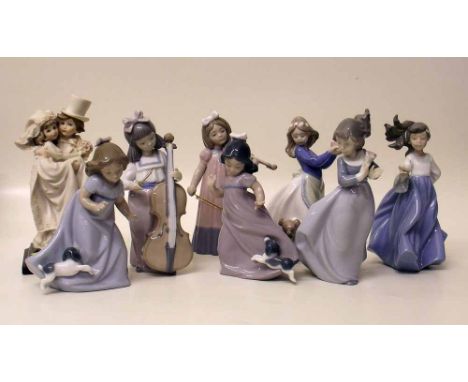 Seven Nao figures and an Armani figure. Condition report: see terms and conditions