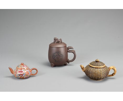 A GROUP OF CHINESE YIXING POTTERY TEAPOTS, 20TH CENTURY. To include a boxed teapot with certificate by, Long Zhou Xingxiang, 