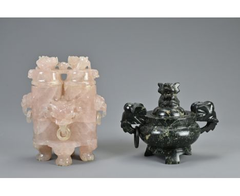 TWO CHINESE CARVED STONE CENSERS, 20TH CENTURY. To include a large rose quartz censer with lion mask ring handles and lion fi