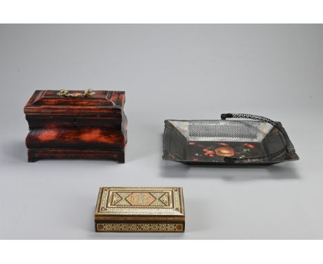 A 19TH CENTURY PAINTED TOLE BOIS SIMULE TEA CADDY, A MIDDLE EASTERN INLAID BOX AND COVER AND A PAINTED TOLE JAPANNED FRUIT OR