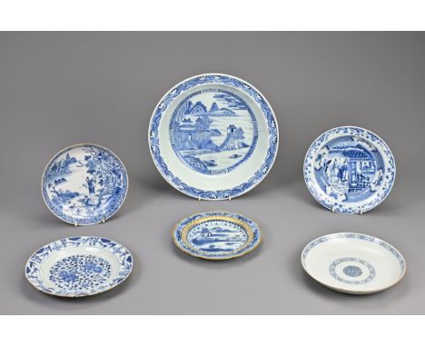 A GROUP OF CHINESE BLUE AND WHITE PORCELAIN DISHES, 18TH CENTURY. To include a large deep dish decorated with buildings in a 