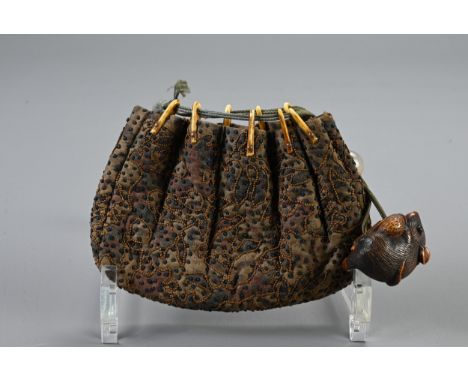A JAPANESE EMBROIDERED POUCH WITH BOXWOOD NETSUKE, MEIJI PERIOD. The fabric pouch with probably stag antler sections holding 