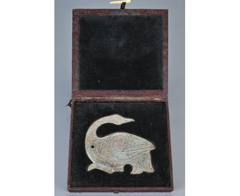 A LARGE CHINESE NEPHRITE JADE PENDANT IN THE FORM OF A PHOENIX. Recumbent figure with its head turned towards its back. Fitte