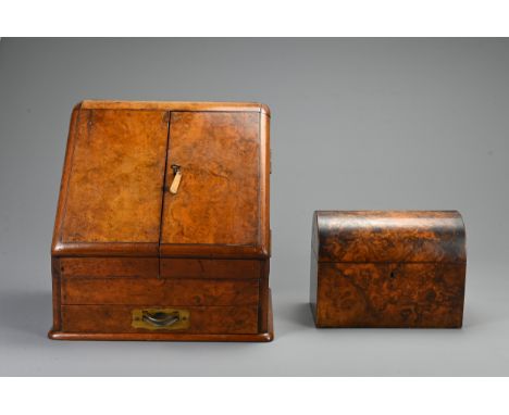 AN EDWARDIAN WALNUT STATIONARY BOX AND A 19TH CENTURY DOMED RECTANGULAR TEA CADDY. The hinged stationary box fitted with a ca