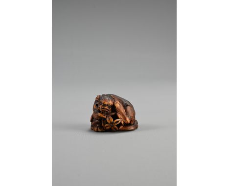 JAPANESE EDO PERIOD BOXWOOD NETSUKE OF A SHISHI GUARDING A SACRED BALL, Mid 19th century, Asakusa school, signed Sato Masayos