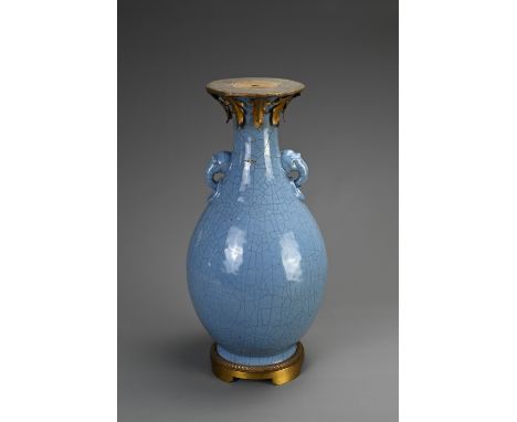 A LARGE CHINESE MONOCHROME BLUE GLAZED CRACKLE VASE, 18/19TH CENTURY. Of baluster form with twin animal form ring handles. Wi