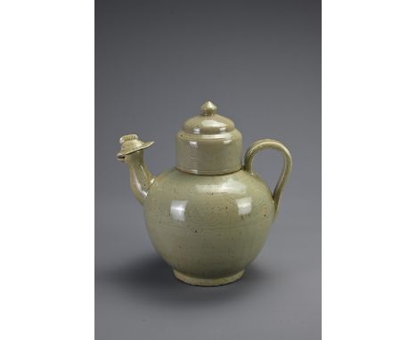 A CHINESE YUEYAO TYPE CELADON GLAZED PHOENIX HEAD EWER AND COVER, SOUTHERN DYNASTIES STYLE. Globular body with strap handle, 