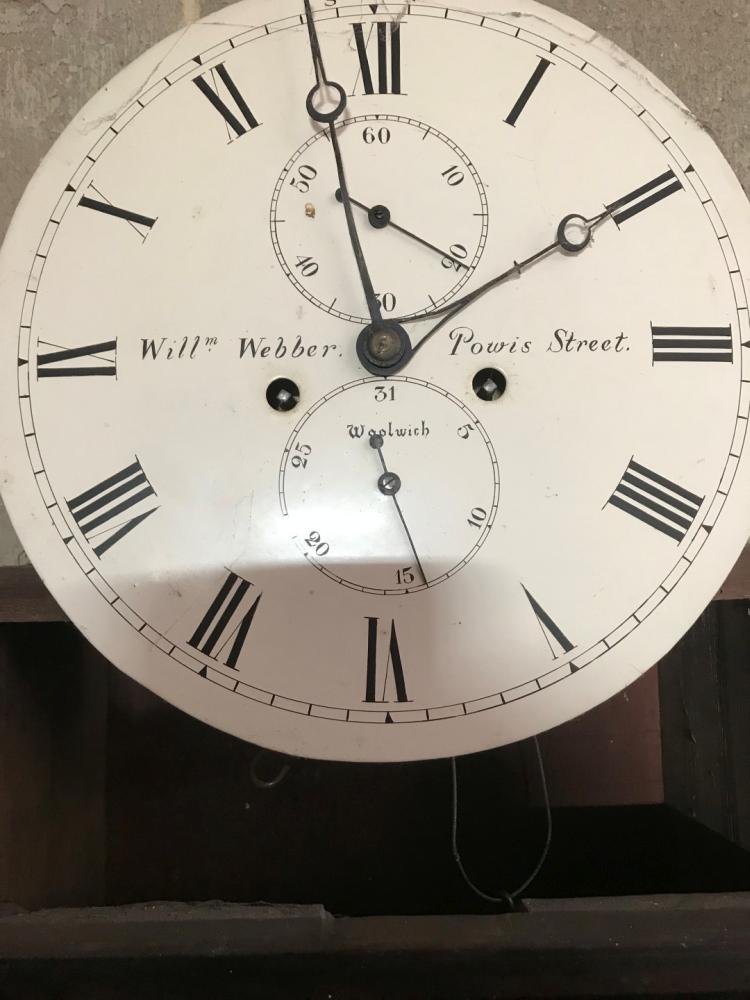 A Regency mahogany longcase clock, the hood with fretwork cresting and