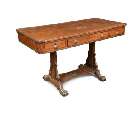 A Regency mahogany sofa table, with ebony line border inlay, fitted one long drawer and two small drawers, brass lion mask an