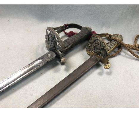 A Victorian officer's Naval pipe back sword, with shagreen grip and gilt lion's head pommel, together with a George V officer