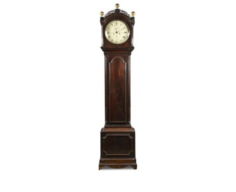 A Regency mahogany longcase clock, the hood with fretwork cresting and brass ball finials, above a 12inch (30.5cm) circular p