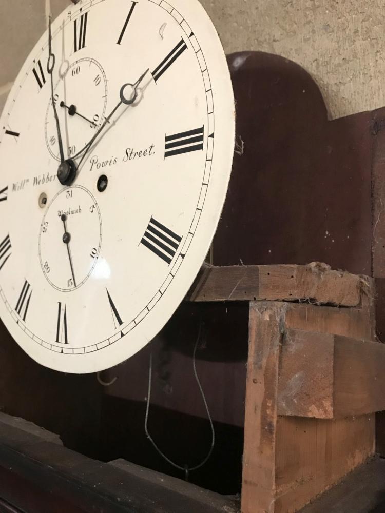 A Regency mahogany longcase clock, the hood with fretwork cresting and