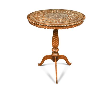 An Indian bone inlaid tripod table, profusely decorated with arabesque, peacock and urn planted trees 58 x 60cm (23 x 23in)  