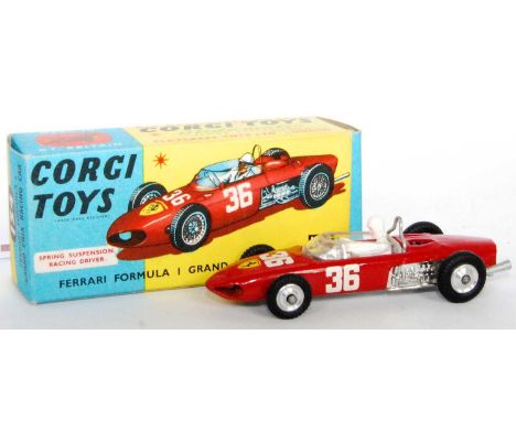 A Corgi Toys No, 154 Ferrari F1 Grand Prix race car comprising red body with spun hubs and racing No. 36 with driver figure h