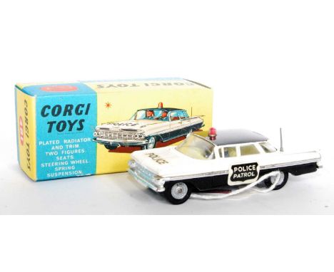 A Corgi Toys No. 481 Chevrolet Impala Police Patrol Car, comprising two-tone black and white body with cast hubs, black roof 