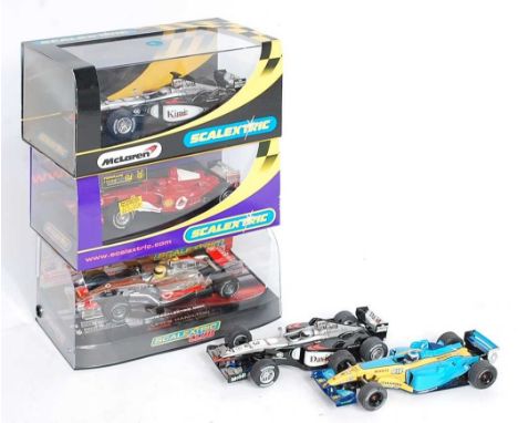 Five various boxed and loose Scalextric F1 race cars to include a Scalextric Club No. C2880 Maclaren MP4-21 Lewis Hamilton ra