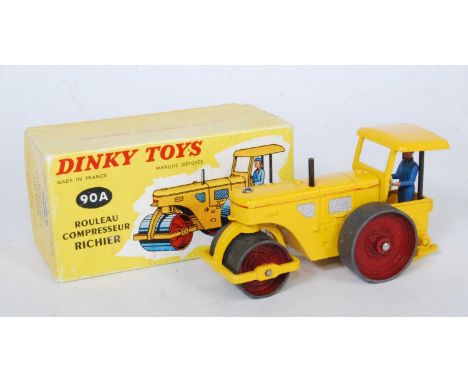 A French Dinky Toys No.90A Richier diesel compressor road roller, comprising of yellow body with red hubs and driver figure, 
