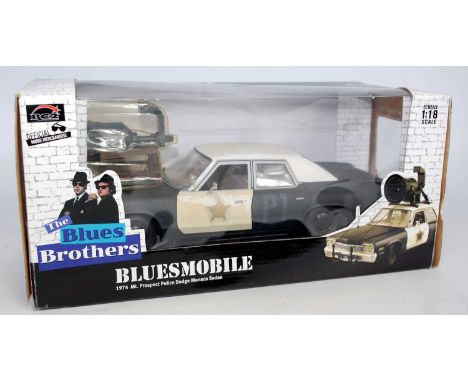 An RC2 Official Merchandise 1/18 scale of a 1974 The Blues Brothers 'Bluesmobile', comprising of black &amp; white body with 