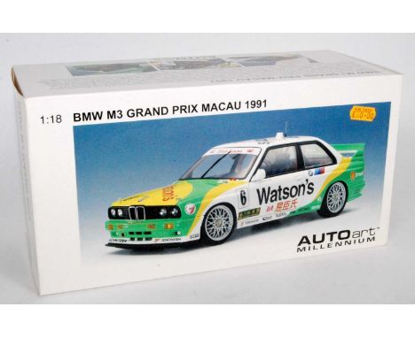 An Auto Art Millennium model No. 89149 model of a 1/18 scale BMW M3 Grand Prix Macau 1991 race car, finished in green, yellow