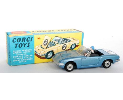 A Corgi Toys No. 318 Lotus Elan S2 comprising of metallic blue body, spun hubs, driver figure and black interior, finished wi