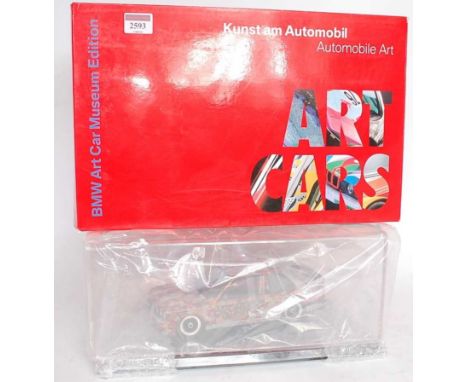 A Minichamps BMW Art Car Museum edition 1/18 scale model of a Michael Jagamara Nelson BMW M3 sports car, appears as issued in