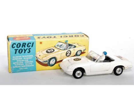 A Corgi Toys No. 318 Lotus Elan S2 comprising of white body with racing No. 5 driver figure, black interior and spun hubs, fi