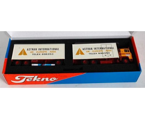 A Tekno 1/50 scale model of a Scania 140 Classic Combi Astran International tractor unit and trailer, housed in the original 