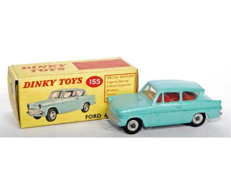 A Dinky Toys No. 155 Ford Anglia comprising of light blue body with red interior and spun hubs, housed in the original all-ca