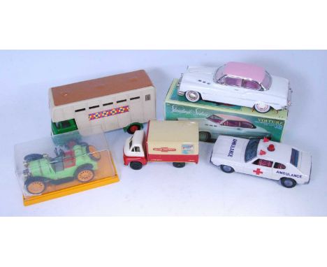 A collection of boxed and loose tinplate vehicles and accessories, to include a Korean ambulance patrol car, Triang horsebox 