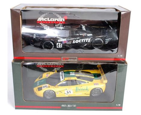 A UT Models and Minichamps 1/18 scale boxed Maclaren diecast group to include a Pauls Model Art No. 151851 Maclaren F1 GTR Ma
