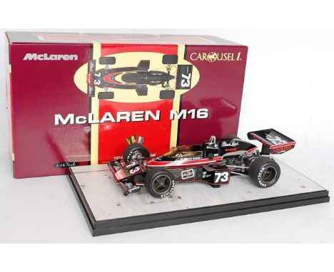 A Carousel 1 1/18 scale boxed Maclaren M16 1974 Indy 500 winner group to include No. 4801 No. 3 Maclaren M16 as driven by Joh