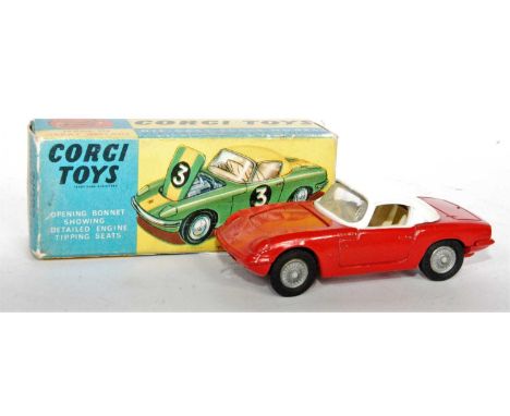 A Corgi Toys No. 319 Lotus Elan coupé comprising of red body with white roof and off-white interior with cast wire effect hub