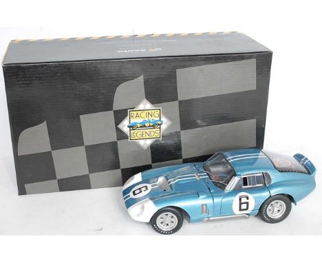 An Exoto Racing Legends No. 18002 1/18 scale model of an AC Cobra Daytona finished in light metallic blue with racing No. 6 a