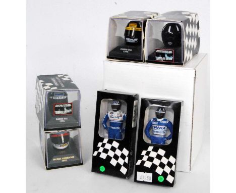 A collection of Minichamps and Amalgam miniature F1 driver figures, helmets, and resin nose cones, to include an Amalgam 1/12