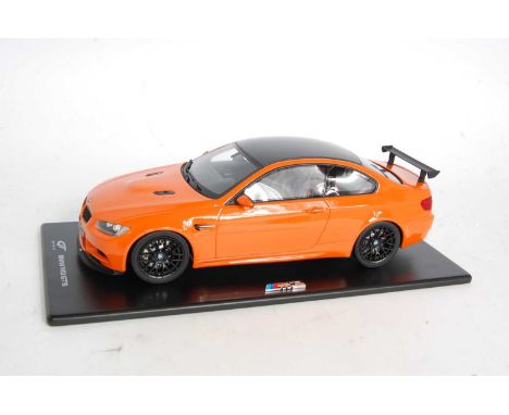 A GTS Models model No. GT015 1/18 scale model of a BMW M3 GTS Highspeed race car, finished in orange, and housed in the origi