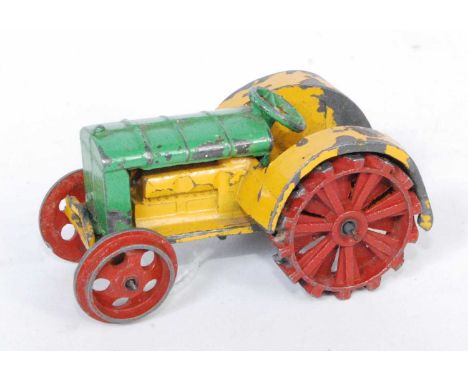 A Dinky Toys No.22E pre-war farm tractor, comprising of yellow and green body with red hubs (playworn with little fatigue)Con