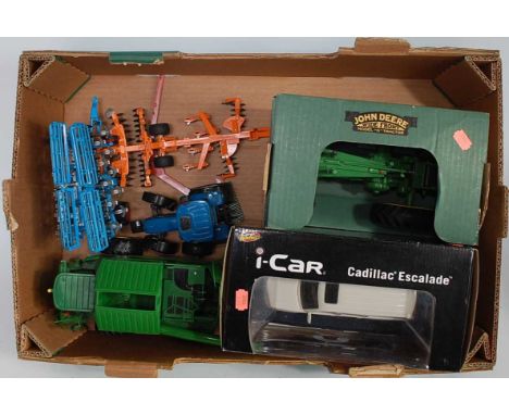Two boxes containing a  quantity of  various loose and boxed Britains and other mainly farm implements and accessories, to in