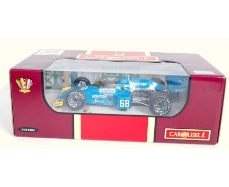 A Carousel 1 No. 4810 1/18 scale model of a Maclaren M16 1975 Indy 500 race car comprising of blue, white and yellow body wit