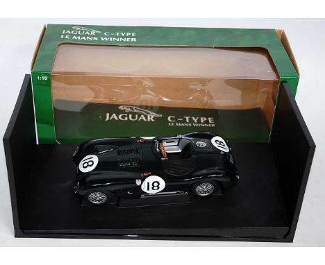 An Auto Art Racing Division model No. 85387 1/18 scale model of a Jaguar C-type Le Mans 1953 winners race car, finished in Br