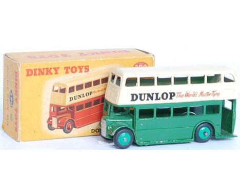 A Dinky Toys No. 290 Dunlop double decker bus comprising of cream and green body with light green hubs and Dunlop livery, hou