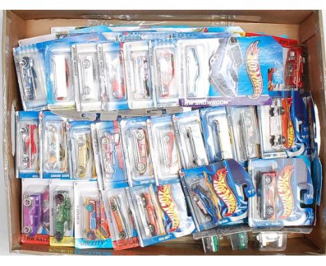 Two boxes containing a very large quantity of various long card and short card Hot Wheels Mattel diecasts, mixed examples to 